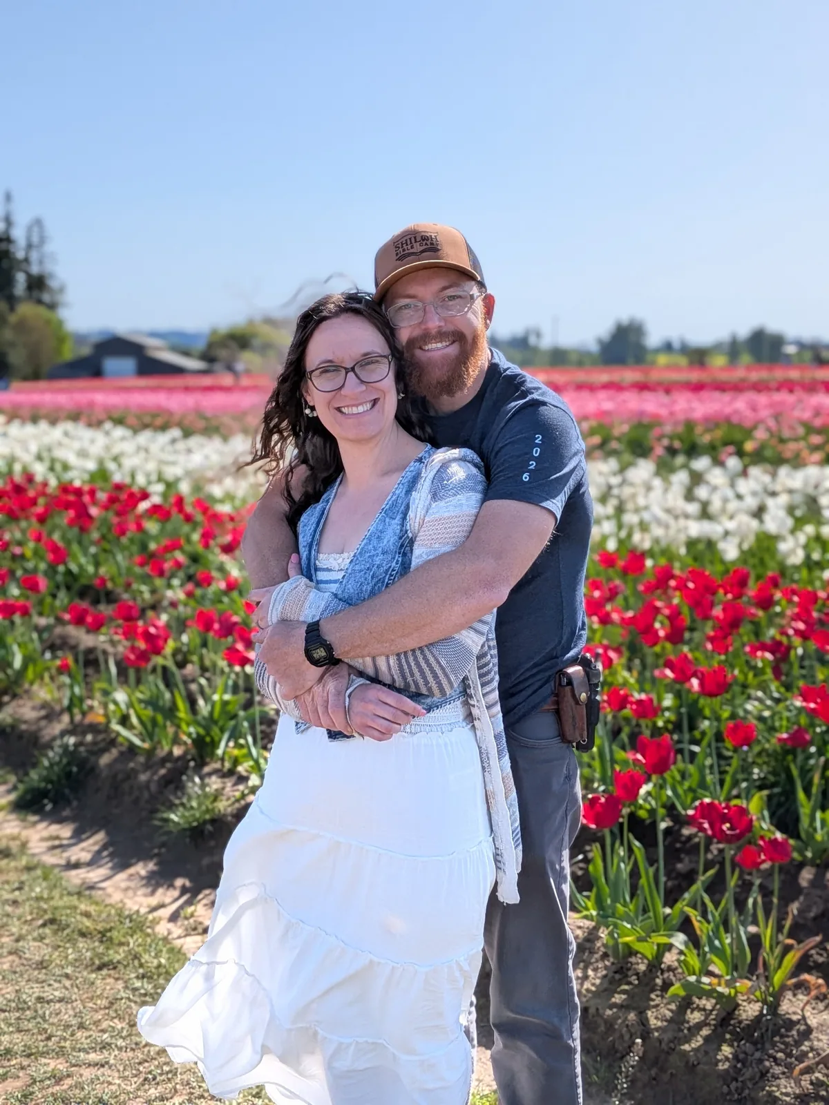 Chase and Stephanie together in a field of flowers